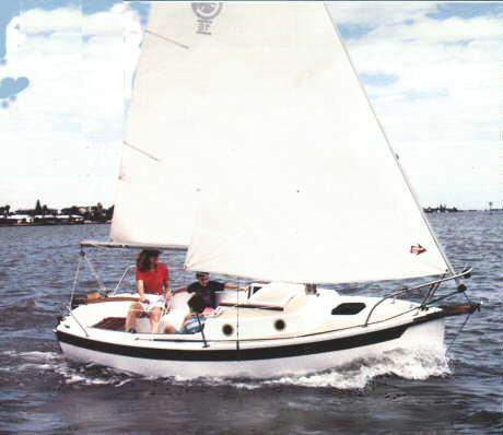 Com pac 16 sailboat under sail