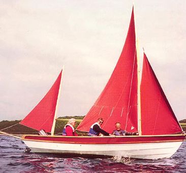 Drascombe lugger sailboat under sail