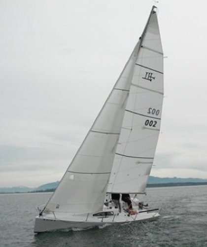 Left coast dart sailboat under sail