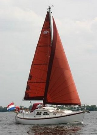 Midget 26 sailboat under sail