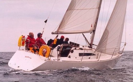 Mustang 30 sailboat under sail
