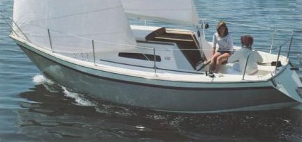 Triton 25 sailboat under sail